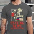 Staying Alive One Book At A Time Skeleton Reading Librarian Unisex Jersey T-Shirt