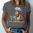 Bigfoot Reading a Cookbook Unisex Jersey T-Shirt Bigfoot Reading a Cookbook Unisex Jersey T-Shirt