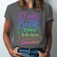 I Put My Book Down To Be Here Whimsical Graphic For Readers Unisex Jersey T-Shirt I Put My Book Down To Be Here Whimsical Graphic For Readers Unisex Jersey T-Shirt