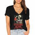 Staying Alive One Book At A Time Skeleton Reading Librarian Women's Jersey Short Sleeve Deep V-Neck Tshirt Staying Alive One Book At A Time Skeleton Reading Librarian Women's Jersey Short Sleeve Deep V-Neck Tshirt