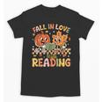 Fall In Love With Reading Autumn Pumpkin Teacher Book Lover Unisex T-Shirt Fall In Love With Reading Autumn Pumpkin Teacher Book Lover Unisex T-Shirt