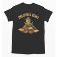 Unearth a Story Dinosaur Reading Books Summer 2026 Unisex T-Shirt Unearth a Story Dinosaur Reading Books Summer 2026 Unisex T-Shirt