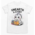 Unearth a Story Cute Dinosaur Summer Reading 2026 Dino Book Unisex T-Shirt Unearth a Story Cute Dinosaur Summer Reading 2026 Dino Book Unisex T-Shirt