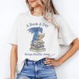 A Book A Day Keeps Reality Away Premium Tri-Blend Unisex T-Shirt