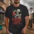 Staying Alive One Book At A Time Skeleton Reading Librarian Unisex T-Shirt
