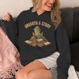 Unearth a Story Dinosaur Reading Books Summer 2026 Unisex Hoodie Unearth a Story Dinosaur Reading Books Summer 2026 Unisex Hoodie