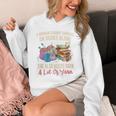 A Woman Cannot Survive On Books Alone She Needs Yarn Crochet Premium Tri-Blend Unisex Hoodie