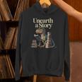 Unearth A Story Dinosaur Reading a Library Book Unisex Hoodie Unearth A Story Dinosaur Reading a Library Book Unisex Hoodie