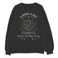 A Book A Day Keeps Reality Away Unisex Sweatshirt