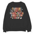 CHASING THAT SCHOLASTIC BOOK FAIR HIGH Unisex Sweatshirt