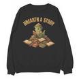 Unearth a Story Dinosaur Reading Books Summer 2026 Unisex Sweatshirt Unearth a Story Dinosaur Reading Books Summer 2026 Unisex Sweatshirt