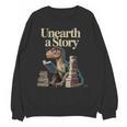 Unearth A Story Dinosaur Reading a Library Book Unisex Sweatshirt