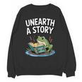 Unearth a Story Frog Reading a Book Summer 2026 Unisex Sweatshirt Unearth a Story Frog Reading a Book Summer 2026 Unisex Sweatshirt