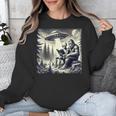 Bigfoot With Alien Reading A Book Bigfoot And UFO Unisex Sweatshirt