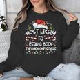 Most Likely To Read A Book Through Christmas Xmas Unisex Sweatshirt Most Likely To Read A Book Through Christmas Xmas Unisex Sweatshirt