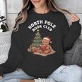 North Pole Book Club Gingerbread Christmas Reading Unisex Sweatshirt North Pole Book Club Gingerbread Christmas Reading Unisex Sweatshirt