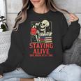 Staying Alive One Book At A Time Skeleton Reading Librarian Unisex Sweatshirt Staying Alive One Book At A Time Skeleton Reading Librarian Unisex Sweatshirt