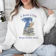 A Book A Day Keeps Reality Away Premium Tri-Blend Unisex Sweatshirt