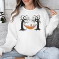 Skeleton Reading Book In Hammock Halloween Reader Unisex Sweatshirt