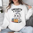 Unearth a Story Cute Dinosaur Summer Reading 2026 Dino Book Unisex Sweatshirt Unearth a Story Cute Dinosaur Summer Reading 2026 Dino Book Unisex Sweatshirt