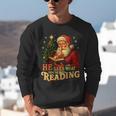 He Sees What You’Ve Been Reading Santa Book Lover Christmas Unisex Sweatshirt