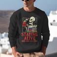 Staying Alive One Book At A Time Skeleton Reading Librarian Unisex Sweatshirt Staying Alive One Book At A Time Skeleton Reading Librarian Unisex Sweatshirt