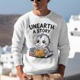 Unearth a Story Cute Dinosaur Summer Reading 2026 Dino Book Unisex Sweatshirt Unearth a Story Cute Dinosaur Summer Reading 2026 Dino Book Unisex Sweatshirt