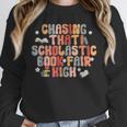 CHASING THAT SCHOLASTIC BOOK FAIR HIGH Unisex Sweatshirt