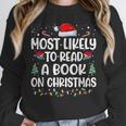 Most Likely To Read A Book On Christmas Matching Family Xmas Unisex Sweatshirt
