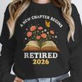 A New Chapter Begins Retired 2026 Floral Book Butterfly Tee Unisex Sweatshirt A New Chapter Begins Retired 2026 Floral Book Butterfly Tee Unisex Sweatshirt