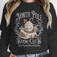 North Pole Book Club Hot Cocoa Served Daily Unisex Sweatshirt North Pole Book Club Hot Cocoa Served Daily Unisex Sweatshirt