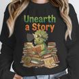 Unearth a Story Triceratops Dinosaur Reading Books Cute Dino Unisex Sweatshirt