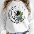 Astronaut Reading Book To Alien Moon Space Astronomy Unisex Sweatshirt