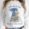 A Book A Day Keeps Reality Away Premium Tri-Blend Unisex Sweatshirt