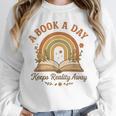 A Book A Day Keeps Reality Away Reading Unisex Sweatshirt A Book A Day Keeps Reality Away Reading Unisex Sweatshirt
