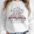 Floral Book A New Chapter Begins Retired 2026 Retirement Unisex Sweatshirt
