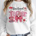 HUGvyn One Loved Teacher Valentine Book Heart Reading Bow Unisex Sweatshirt HUGvyn One Loved Teacher Valentine Book Heart Reading Bow Unisex Sweatshirt