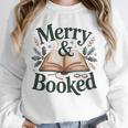 Merry And Booked Holiday Reading Winter Book Lover Premium Tri-Blend Unisex Sweatshirt