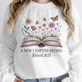 a New Chapter Begins Retired 2025 Floral Book Retirement Unisex Sweatshirt a New Chapter Begins Retired 2025 Floral Book Retirement Unisex Sweatshirt