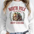 North Pole Book Club Hot Cocoa Bookworm Christmas Xmas Unisex Sweatshirt North Pole Book Club Hot Cocoa Bookworm Christmas Xmas Unisex Sweatshirt