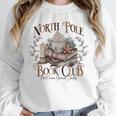 North Pole Book-Club Hot Cocoa Served Daily Christmas Book Unisex Sweatshirt North Pole Book-Club Hot Cocoa Served Daily Christmas Book Unisex Sweatshirt