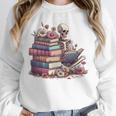 Reading A Book Per Day Keeps Reality Away Skeleton Books Unisex Sweatshirt Reading A Book Per Day Keeps Reality Away Skeleton Books Unisex Sweatshirt