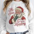 He Sees What You'Ve Been Reading Bookish Christmas Humor Unisex Sweatshirt He Sees What You'Ve Been Reading Bookish Christmas Humor Unisex Sweatshirt