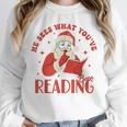 He Sees What You'Ve Been Reading Santa Book Unisex Sweatshirt He Sees What You'Ve Been Reading Santa Book Unisex Sweatshirt