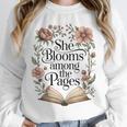 She Blooms Among The Pages Women Mom Wife Floral Book Lover Premium Tri-Blend Unisex Sweatshirt She Blooms Among The Pages Women Mom Wife Floral Book Lover Premium Tri-Blend Unisex Sweatshirt