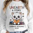 Unearth a Story Cute Kitten Summer Reading 2026 Cat Book Unisex Sweatshirt Unearth a Story Cute Kitten Summer Reading 2026 Cat Book Unisex Sweatshirt