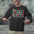 Groovy Christmas Most Likely To Read A Book On Christmas Unisex Sweatshirt Groovy Christmas Most Likely To Read A Book On Christmas Unisex Sweatshirt