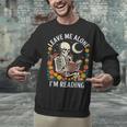 Leave Me Alone Skeleton Reading Book Floral Moon Librarian Unisex Sweatshirt