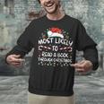 Most Likely To Read A Book Through Christmas Xmas Unisex Sweatshirt Most Likely To Read A Book Through Christmas Xmas Unisex Sweatshirt
