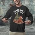 North Pole Book Club Gingerbread Christmas Reading Unisex Sweatshirt North Pole Book Club Gingerbread Christmas Reading Unisex Sweatshirt